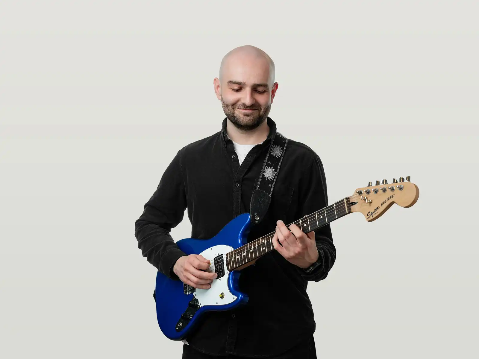 Alex playing the bass guitar