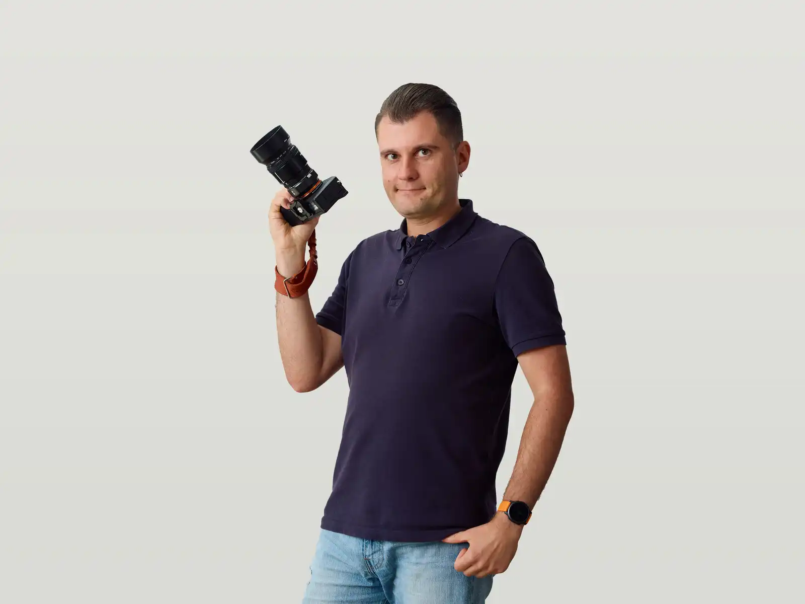 Andrei holding a DSLR camera