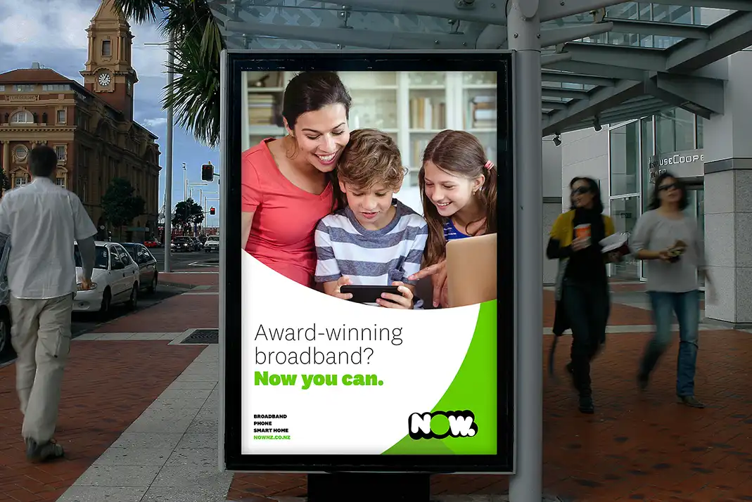 A Now NZ advert on a bus stop